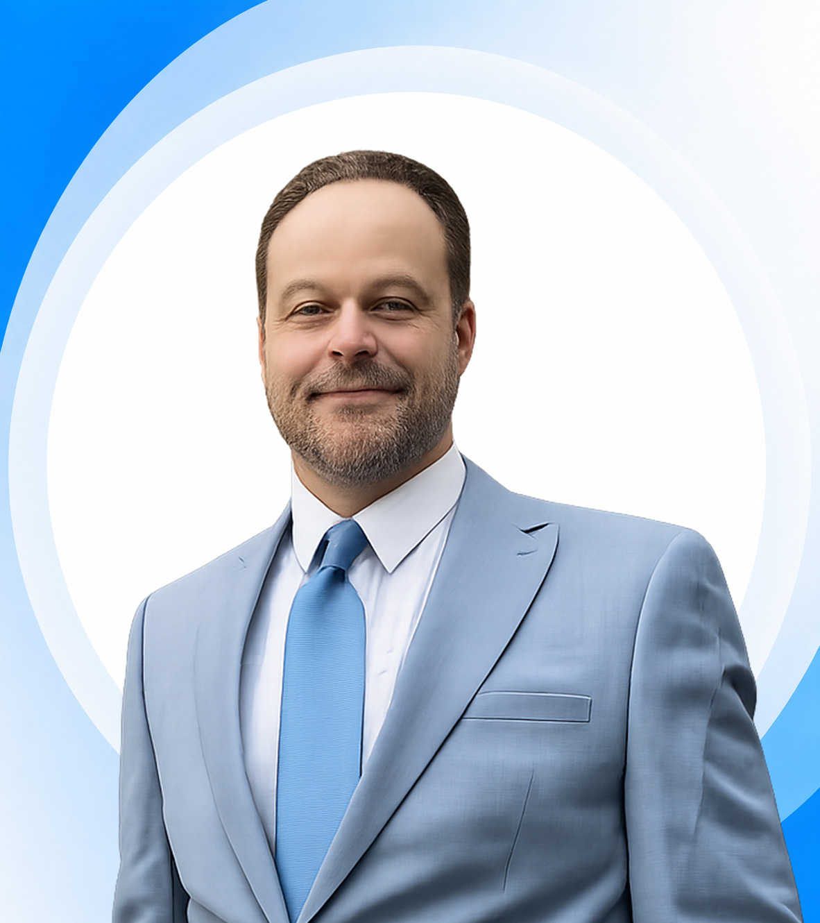 Man in light blue suit and tie portrait